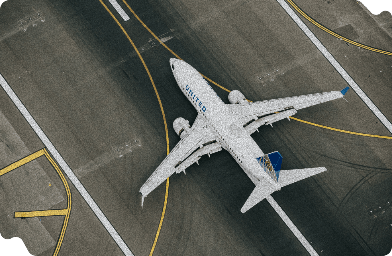 Aerial view of airplane on runway